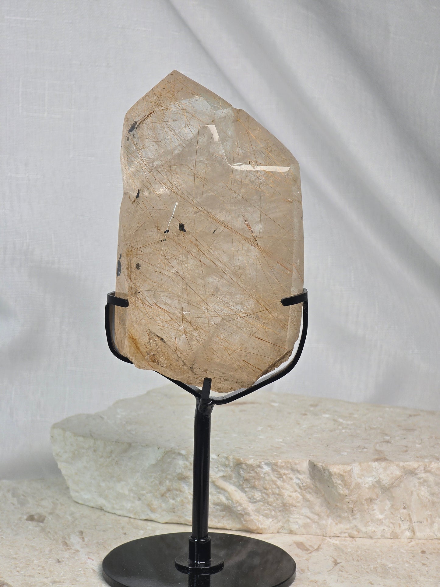 Gold/Copper Rutile in Quartz with Mica inclusions Point on stand